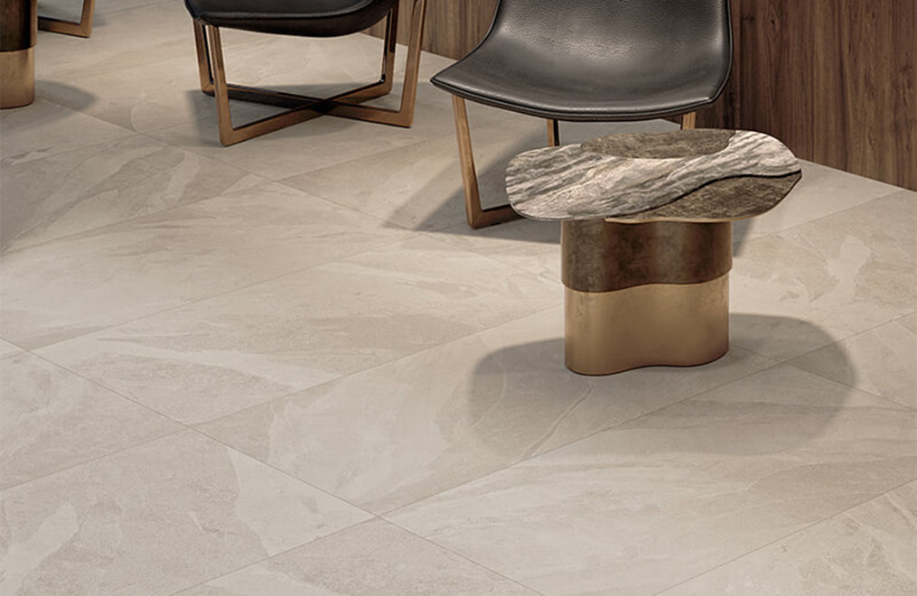 Modern coffee table with a natural stone top on a tiled floor