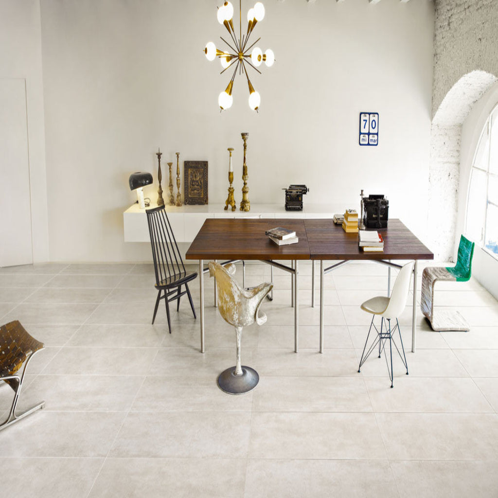 Modern office space with a wooden desk, chairs, and decorative items.