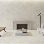 Modern living room with a fireplace, white sofa, and wooden coffee table.
