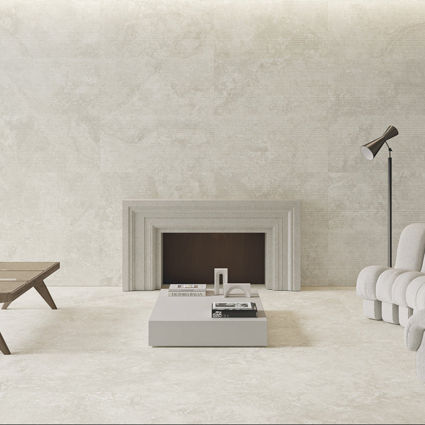 Modern living room with a fireplace, white sofa, and wooden coffee table.